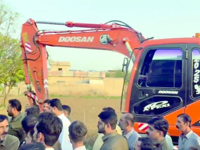 locals stand guard over their ancestral land as officials arrive with machinery to raze settlements at dadochha dam site on the outskirts of rawalpindi photo express