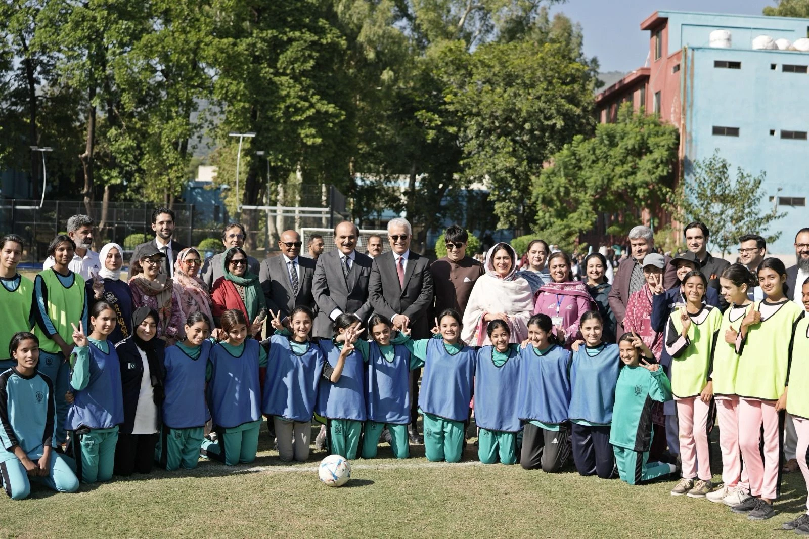 the asian football confederation president and vice president of fifa sheikh salman bin ibrahim al khalifa in group picture after football match at islamabad college for girls photo courtesy zulfiqar baig