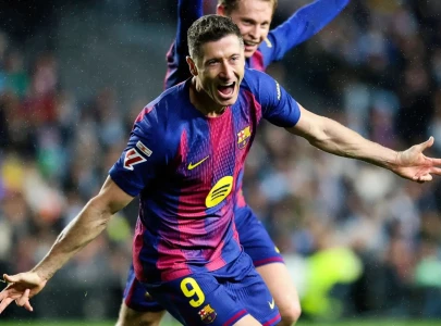 lewandowski hat trick helps barca punish real madrid slip