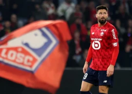 lille s forward olivier giroud reacts after scoring a goal during the match against paris fc photo afp