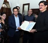 sindh cm murad ali shah presents a birth certificate to a parent during a launch of the civil registration management system crms mobile application at cm house in karachi on november 28 photo ppi