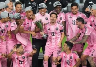 inter miami forward lionel messi 10 holds the trophy as inter miami players celebrate winning the mls eastern conference final match against new york city fc photo afp