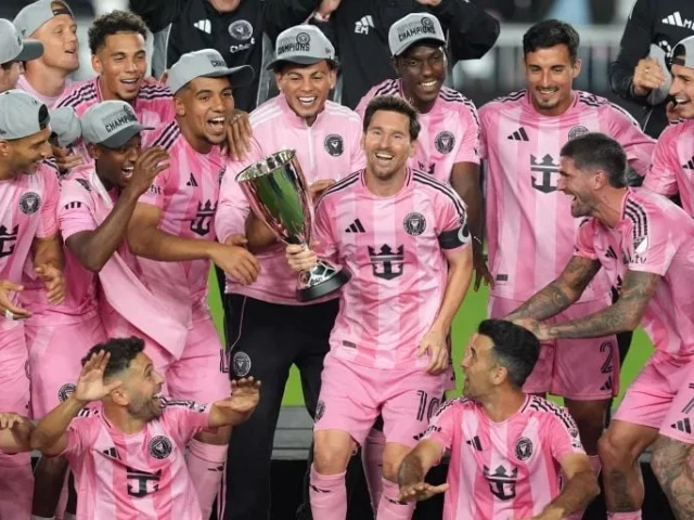 inter miami forward lionel messi 10 holds the trophy as inter miami players celebrate winning the mls eastern conference final match against new york city fc photo afp