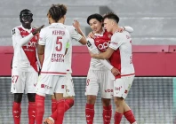 monaco s japanese forward takumi minamino scores his team s first goal in the ligue 1 match against paris saint germain photo afp