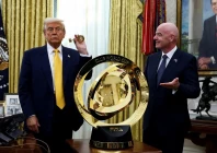 u s president donald trump and fifa president gianni infantino stand next to the fifa club world cup trophy in the oval office of the white house in washington d c u s march 7 2025 photo reuters
