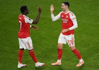 mikel merino and bukayo saka were on target as arsenal kept the initiative in the premier league title race with a routine 2 0 win over brentford photo afp