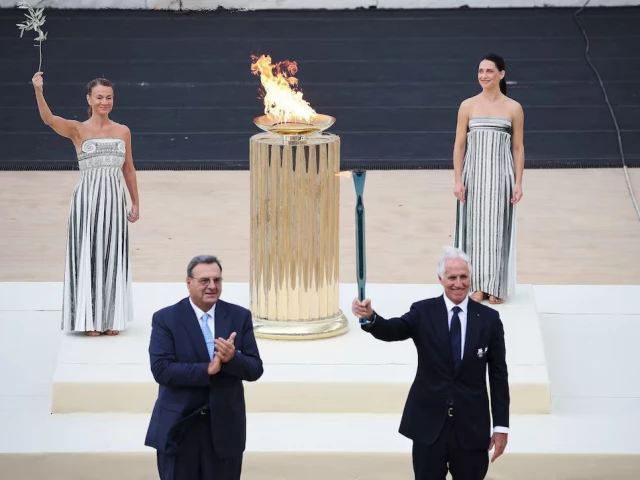 the olympic flame arrived in rome on thursday in preparation for a two month torch relay designed to stir excitement across italy before the winter games in milan and cortina d ampezzo in february photo reuters