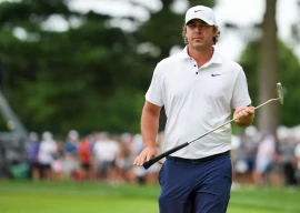 brooks koepka of smash gc lines up a putt on the 17th green during the semifinals of the liv golf michigan team championship at the cardinal at saint john s resort photo reuters