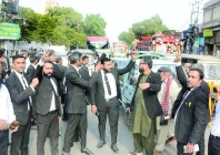lawyers stage protest on ma jinnah road on tuesday over registration of fir against lawyers who allegedly attacked youtuber rajab butt in the city courts premises on monday photo express lawyers stage protest on ma jinnah road on tuesday over registration of fir against lawyers who allegedly attacked youtuber rajab butt in the city courts premises on monday photo express