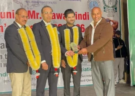 naeem butt of the rawalpindi district bodybuilding association presents a shield to pakistan muslim league n leader usama chaudhry