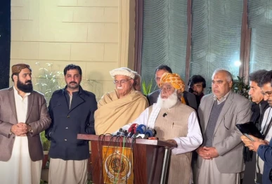 jamiat ulema e islam chief maulana fazlur rehman addresses a press conference in islamabad on friday flanked ttap chief mahmood khan achakzai and pti s asad qaiser screengrab