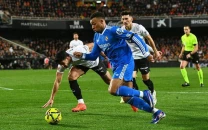real madrid edge valencia to stay on barca s tail