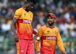 zimbabwe captain sikandar raza right and quick bowler blessing muzarabani photo afp