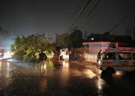 an uprooted tree is seen in karachi after heavy downpour and gusty winds sweep the metropolis on march 18 2026 photo express