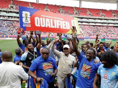 dr congo fans dance in the rain