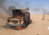 houthi fighters move next to a destroyed vehicle following what the source described as an attack on saudi backed forces in the location given by the source as al jawf governorate yemen in this screengrab taken from a video released by houthi military media on september 15 2026 photo reuters