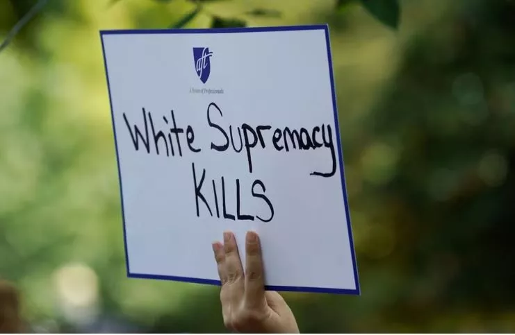 a woman holds a sign during a rally against guns and white supremacy in the wake of mass shootings in dayton and el paso in front of the white house in washington u s august 6 2019 photo reuters a woman holds a sign during a rally against guns and white supremacy in the wake of mass shootings in dayton and el paso in front of the white house in washington u s august 6 2019 photo reuters