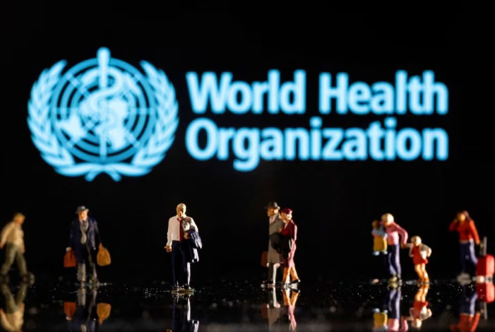 small figurines are seen in front of displayed world health organization logo in this illustration taken february 11 2022 reuters dado ruvic ilustration file photo acquire licensing rights