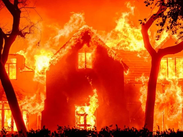 a large family home is completely engulfed by flames during la wildfires as climatic changes also played a role in the fire events photo afp