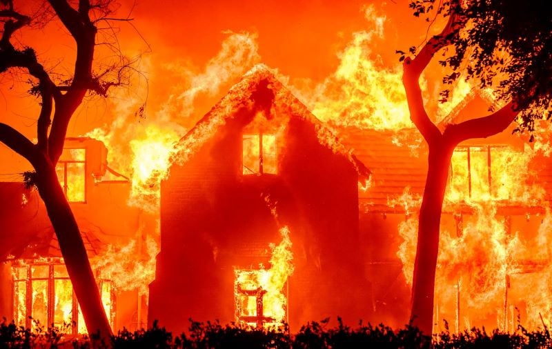 a large family home is completely engulfed by flames during la wildfires as climatic changes also played a role in the fire events photo afp