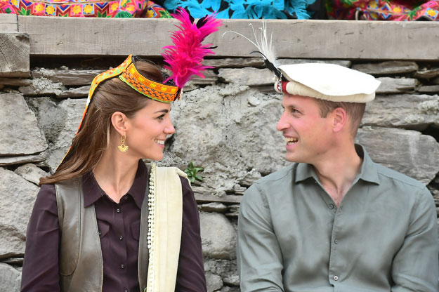 Britain's Prince William and Catherine, Duchess of Cambridge look at each other while visiting a settlement of the Kalash people in Chitral on Wednesday. PHOTO: REUTERS