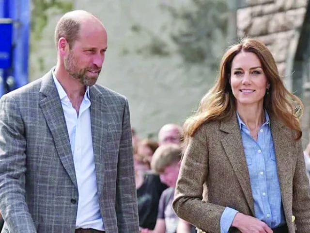 prince william and his wife kate photo file