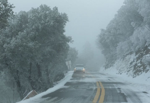 view of an icy road as a massive winter storm passes along the west coast on mount hamilton near san jose california u s february 23 2023 reuters laure andrillon view of an icy road as a massive winter storm passes along the west coast on mount hamilton near san jose california u s february 23 2023 reuters laure andrillon