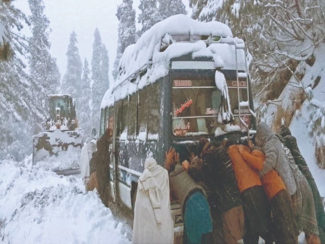 people attempt to push a vehicle through several inches of snow in abbottabad s khairagali as heavy snow creates hazardous and at times impassable driving conditions photo ppi