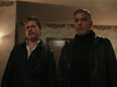 review wolfs offers lighthearted crime caper with brad pitt and george clooney but lacks impact