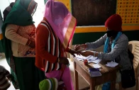 a woman gets her finger inked before casting her vote at a polling station during the state assembly election in the town of vrindavan in the northern state of uttar pradesh india february 10 2022 photo reuters file