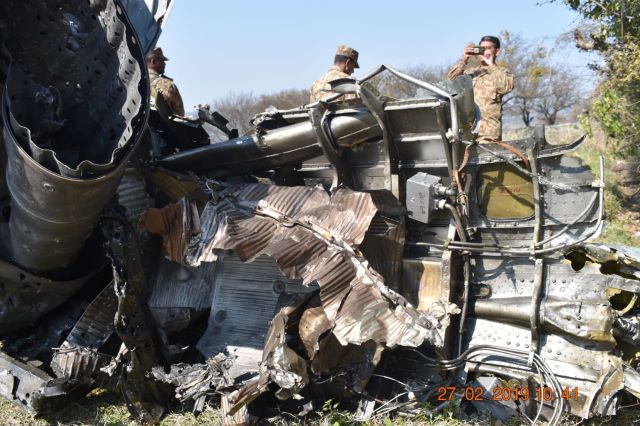 Pakistan Army inspects wreck of downed IAF jet. -EXPRESS