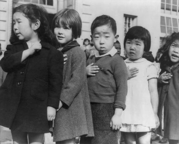 First-graders, some of Japanese ancestry, at the Weill public school in San Francisco pledge allegiance to the United States flag, April 1942. The children of Japanese ancestry will be housed in war relocation authority centres for the duration of the war. PHOTO: REUTERS
