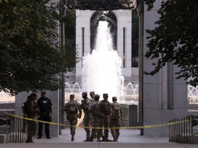 members of the national guard stand near the world war ii memorial after the pool was reportedly vandalized with soap and graffiti in washington dc us august 13 2026 photo reuters members of the national guard stand near the world war ii memorial after the pool was reportedly vandalized with soap and graffiti in washington dc us august 13 2026 photo reuters