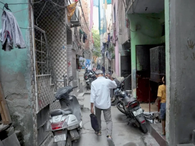kamta prasad walks through an alley in new delhi photo reuters kamta prasad walks through an alley in new delhi photo reuters