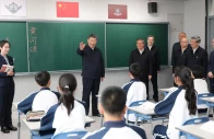 chinese president xi jinping talks with students in a classroom at a high school during an inspection tour of xiongan new area in hebei province china on march 23 2026 photo reuters