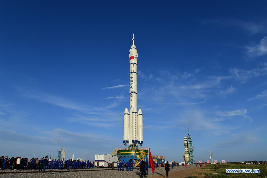 the combination of the shenzhou 12 manned spaceship and a long march 2f carrier rocket is being transferred to the launching area of jiuquan satellite launch center in northwest china june 9 2021 photos xinhua