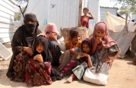 rawya hassan a mother of seven sits with her children outside their hut at the al bireen camp for displaced people who fled fighting between the houthis and forces of yemen s internationally recognized government in taiz province yemen september 17 2026 reuters