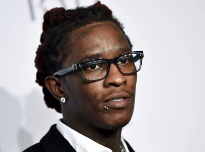 young thug sparks fan theories after tattoos appear missing during complexcon performance