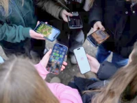 teenagers pose for a picture while looking at their phones in bonn germany february 20 2026 photo reuters