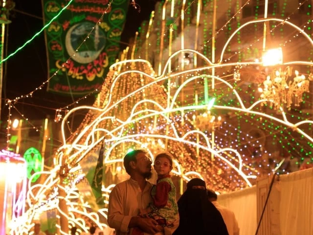 residents visit an illuminated street ahead of eid e milad ul nabi the birth anniversary of holy prophet pbuh in karachi on september 5 2025 photo reuters