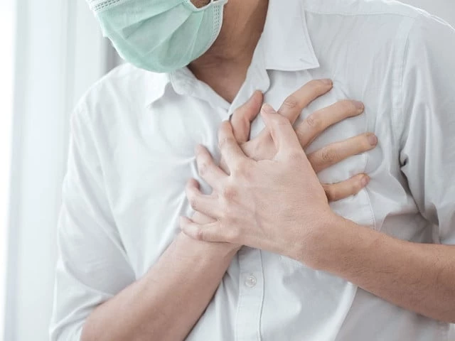 man wear medical face mask symptoms of coronavirus diseases chest pain photo file man wear medical face mask symptoms of coronavirus diseases chest pain photo file