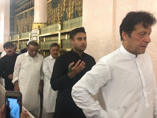 Zulfi Bukhari (left) with Imran Khan at Madinah. PHOTO: ZULFI BUKHARI/ TWITTER